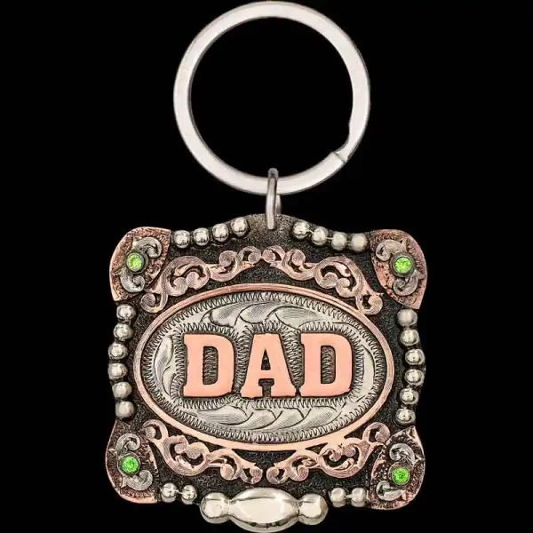 "Woah, is that the Kansas City Buckle? No, it's the Shane Custom Keychain! Crafted after one of our most popular buckles, the Shane Custom Keychain is hand-engraved on a German Silver base with cubic zirconia stones in each Copper corner, featuring C